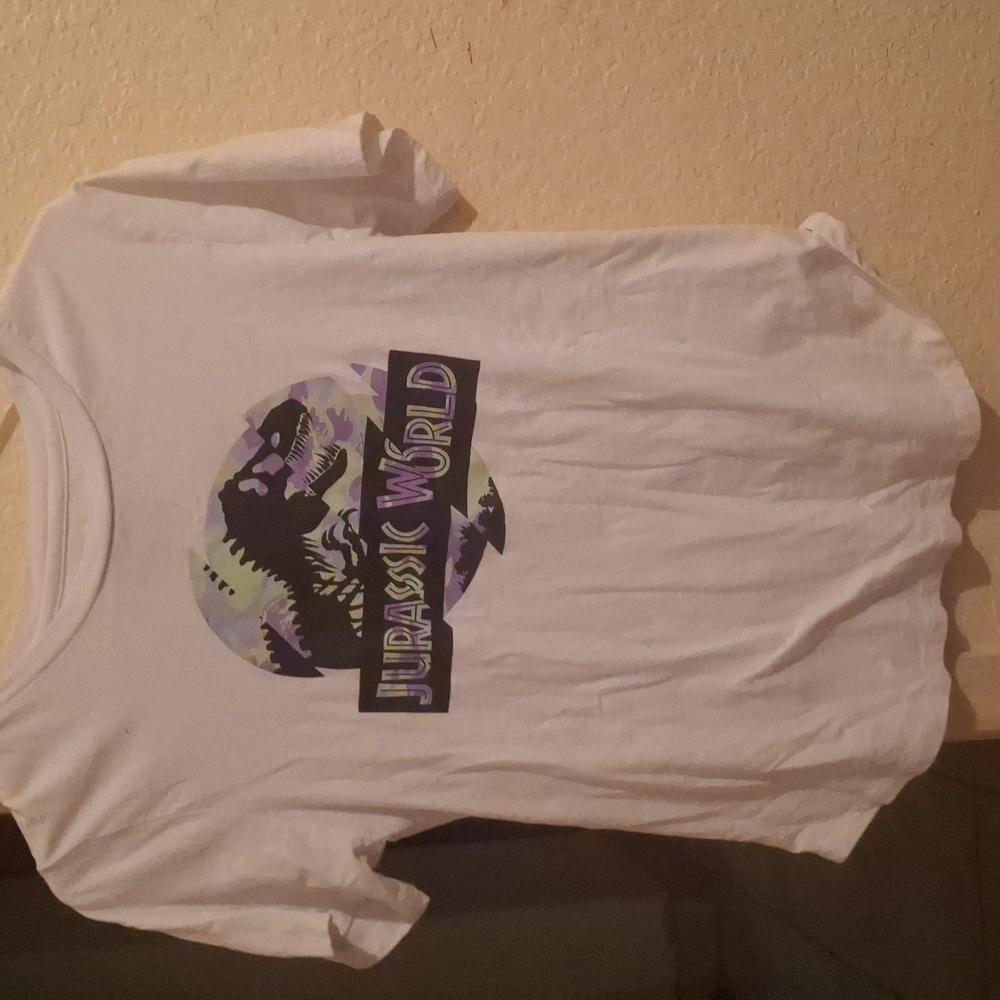A white jurassic world shirt